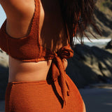 Textured caramel brown flattering scoop neck bikini top with thick shoulder straps and adjustable tie-back.