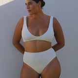 White high-waisted, cheeky cut bikini bottom made from premium textured 5D fabric with power mesh lining to contour, sculpt and give superior support.