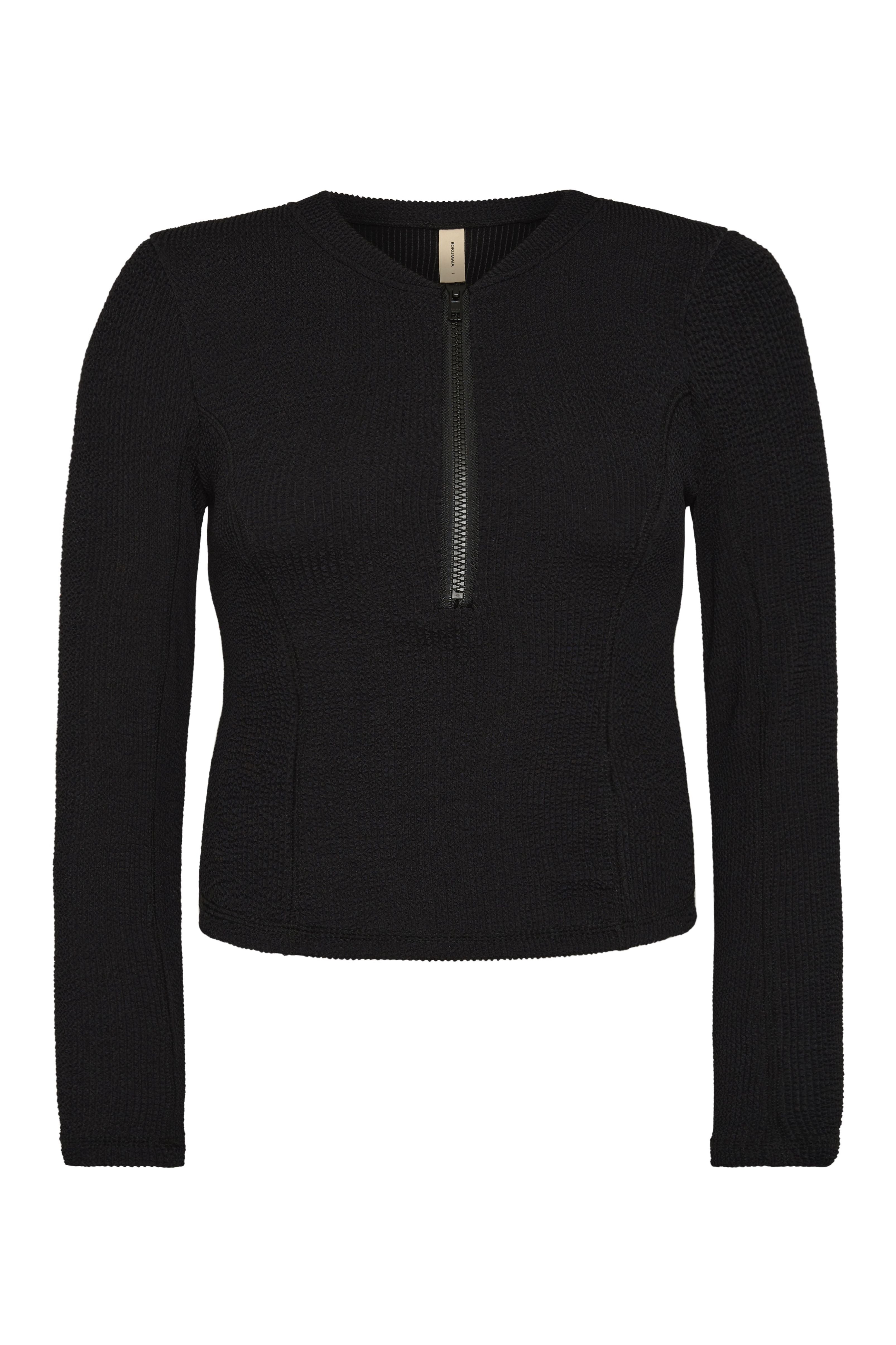 Bokumaia Zephyr black cropped rash vest, flat lay showing the centre front half zip