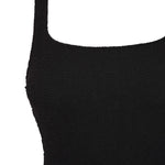 Flat lay detail of the black Azure square neck swimsuit showing its shoulder strap