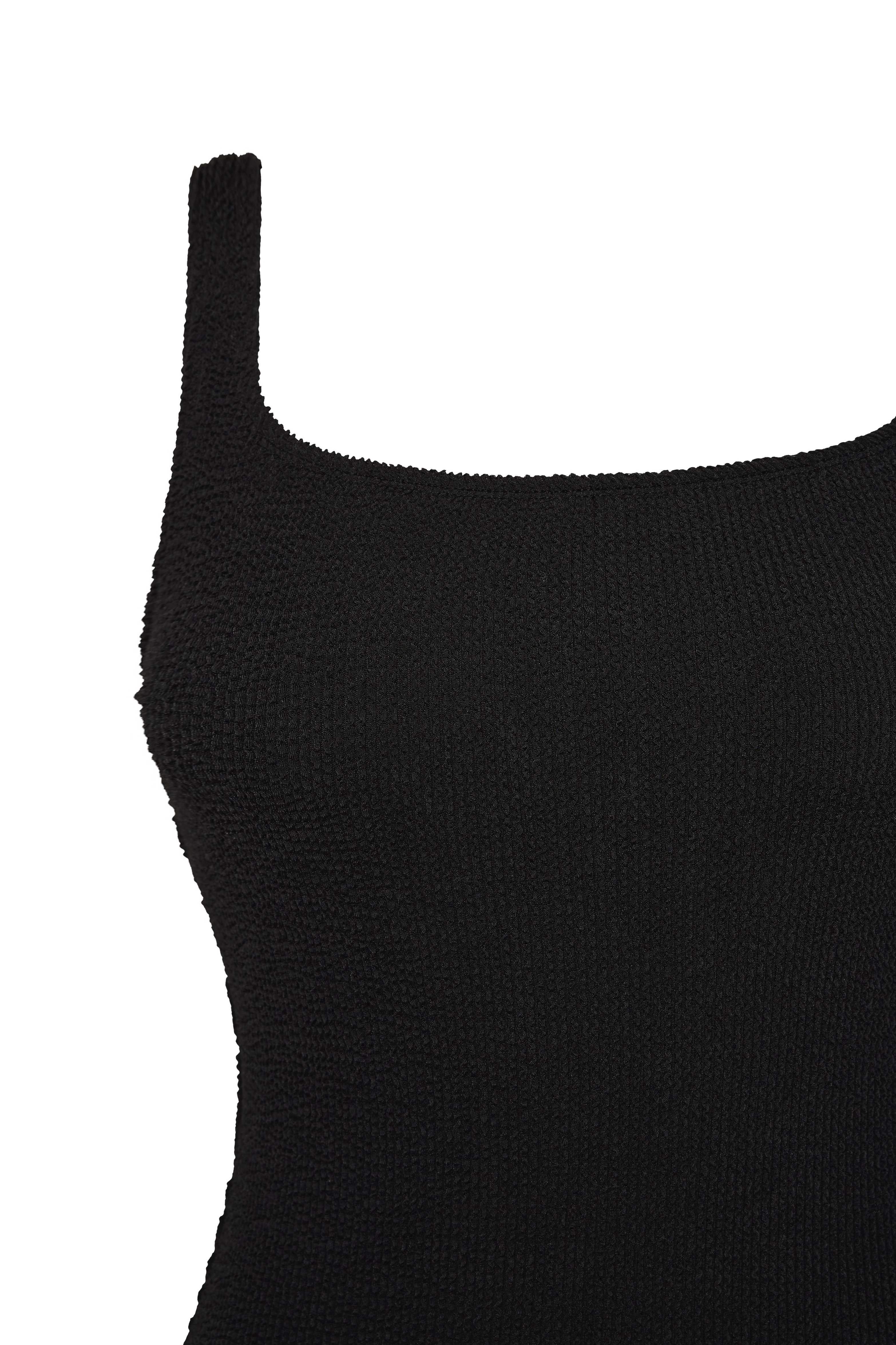 Flat lay detail of the black Azure square neck swimsuit showing its shoulder strap