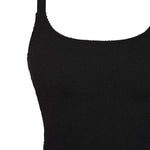 Flat lay close-up of textured 5D fabric on a black supportive one piece swimsuit