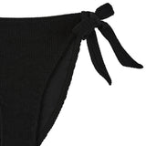 Flat lay side detail of the black Halo bikini bottoms showing the tie fastening