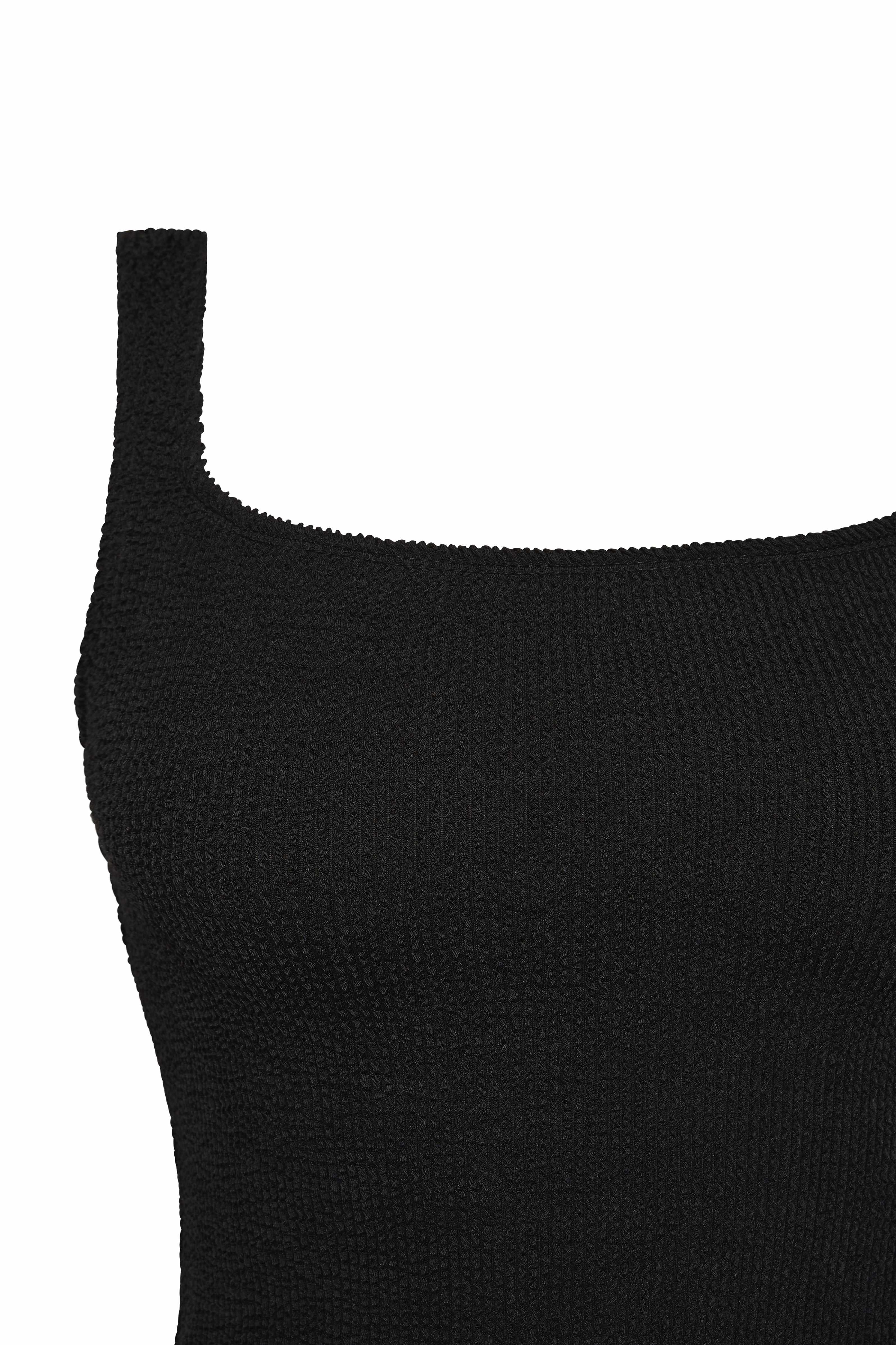 Flat lay detail of the black Sirena square neck tankini top and its shoulder strap