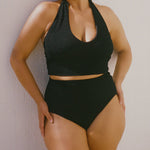Black halter bikini top with built-in support and adjustable tie-neck.