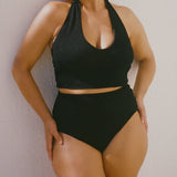 Black halter bikini top with built-in support and adjustable tie-neck.