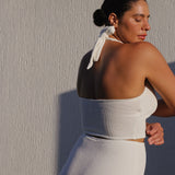 White halter bikini top with built-in support, flattering plunge neckline and adjustable tie-neck.