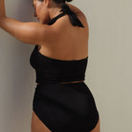 Black halter bikini top with built-in support, flattering plunge neckline and adjustable tie-neck.