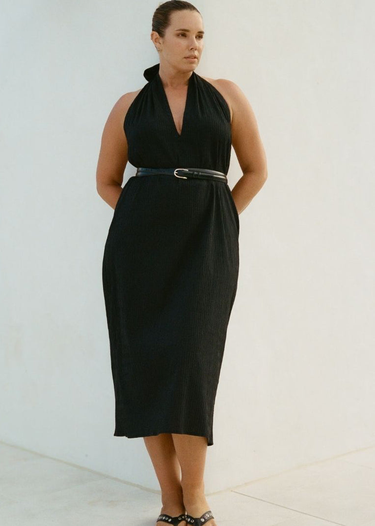 Model wearing Bettina Midi Dress Black with plunge neckline and relaxed fit