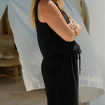 Model wearing Echo Pant Black with relaxed summer silhouette in textured linen