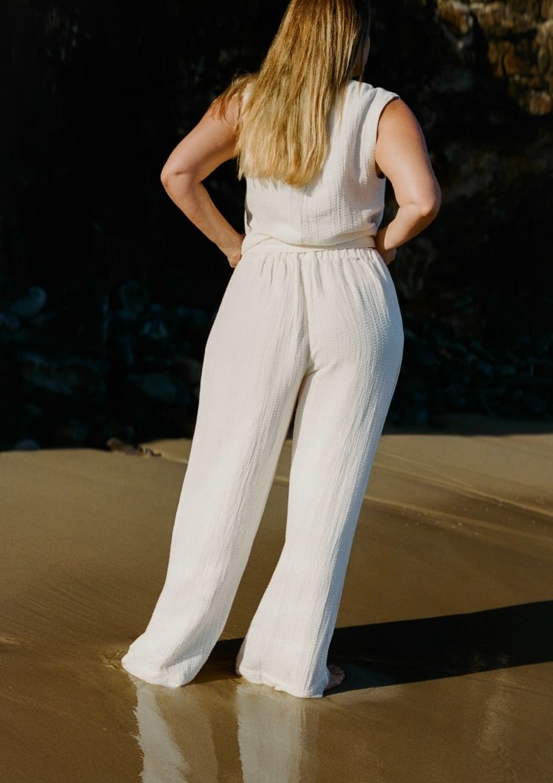 Back view of Echo Pant Ecru relaxed wide leg silhouette in textured linen