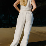 Back view of Echo Pant Ecru relaxed wide leg silhouette in textured linen