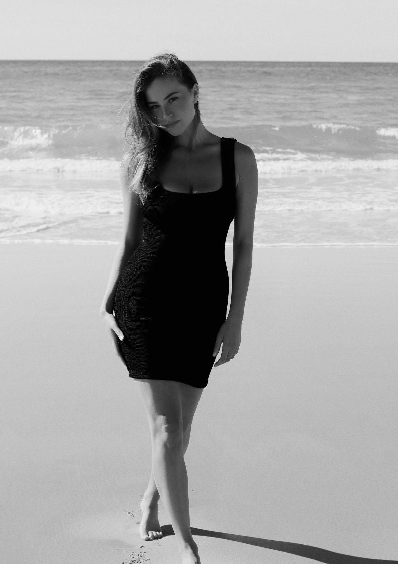 Black textured bodycon mini dress with inbuilt bra support, square neckline and a sleek, sculpting fit. 