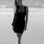 Black textured bodycon mini dress with inbuilt bra support, square neckline and a sleek, sculpting fit. 